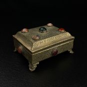 A 20th century Indian inscribed metal trinket box having a rectangular hinged caddy-topped lid inset