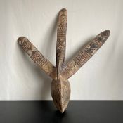 A large possibly 19th century West African carved Bwa-bird mask with pigment from the Bobo