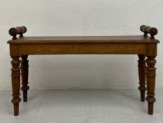 A 19th century oak hall bench or window seat having a rectangular top with canted corners and turned