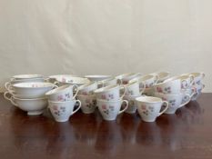 A part set of Royal Doulton Pillar Rose pattern china to include twelve soup bowls, eleven coffee