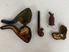 A mixed collection to include a figural Meerschaum pipe in a fitted case along a small Meerschaum