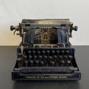 A C.1900 Emerson No.3 typewriter. W.23.5cm (main body)