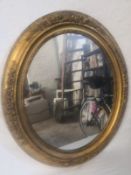 A 19th century wall mirror having a circular plate in a giltwood and gesso frame. 58X51cm (Has an