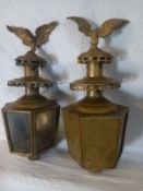 A pair of 19th century brass coach or carriage lamps each having a figural eagle and two-tier pagoda
