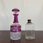 A 20th century Bohemian style cut amethyst crystal decanter along with an early 20th century