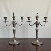 A pair of C.1900 Mappin Brothers silver plated candelabras each having a cup and cover finial