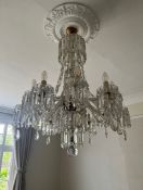 A large 20th century Murano or Baccarat style cut glass chandelier having a baluster form stem