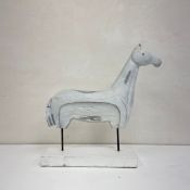 A contemporary painted and distressed moulded abstract figural horse statue raised on a square