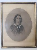 A 19th century charcoal and white chalk portrait of a young girl, signed and dated 1858 to the lower