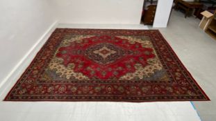 A very large hand knotted Persian style Tabriz carpet having a central diamond lozenge medallion