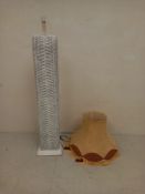 A vintage floor standing lamp having a square Lloyd loom style woven stem with an arched top