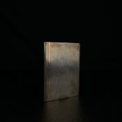 An early 20th century hallmarked and engine turned silver cigarette case by Walker & Hall, Sheffield
