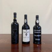 Two bottles of port to include Warre's 1977 vintage and one Taylor's 2003, bottled as a gift to