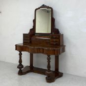 A Victorian burr walnut Duchess style dressing table with adjustable swing mirror raised on turned