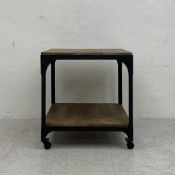 A Decker industrial style metal framed side or lamp table by Anthropologie UK on casters. H.64 W.
