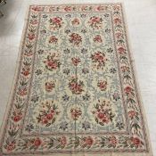 An Aubusson style needlework carpet (or possibly a wall hanging) with all-over swag and flowerhead