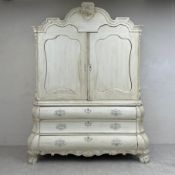 A painted and distressed decorated 19th century two section Dutch linen press, the upper section