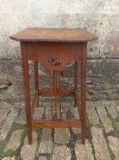 A late 19th century Arts and Crafts oak occasional table having a square top with canted corners