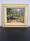 A contemporary oil on canvas, woodland scene, signed to the lower left in a painted frame. 33H x