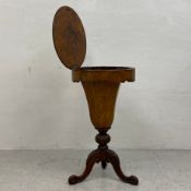 A 19th century burr walnut sewing occasional table having a circular top hinged to reveal a