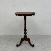 A mid 19th century oak wine table on carved tripod base. H.76.5 Dia.45cm