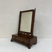A mid Georgian walnut dressing table or toilet mirror with original plate and fitted with three base