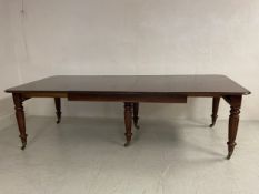 A George IV mahogany extending dining table of good size and expanse with three extra leaves