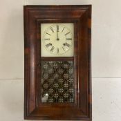 A 19th century flame mahogany cased American wall clock. H.65 W.39cm