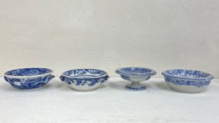 A collection of four 19th century and later blue and white porcelain sponge dishes in two parts to
