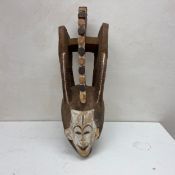 20th century West African Igbo spirit style mask with pigment. H.70cm