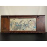 A Japanese ink on paper, figures in a garden in a wide bamboo effect frame, signed. W.120cm