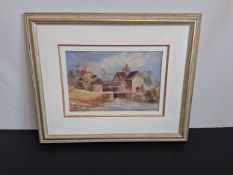 A 20th century watercolour painting of a rural watermill in a glazed frame. 44H x 53W