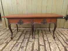 A 19th century French walnut side table having a matched rectangular lift-up top over a shaped and