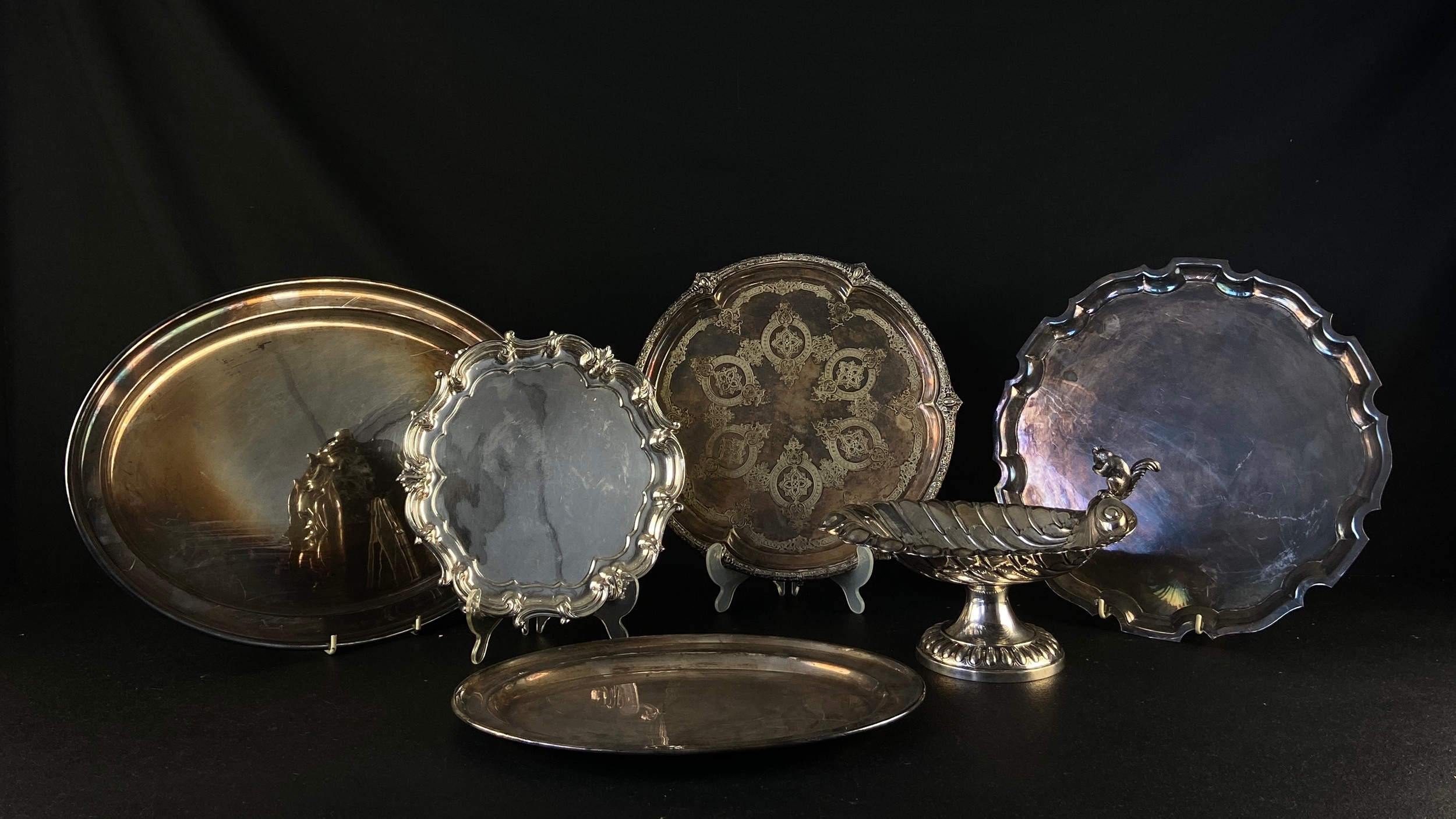 Collection of silver plated trays and salvers and a shell form comport, Elkington, Walker and Hall