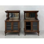 A pair of 19th century walnut music cabinets each having a rectangular top with canted corners and a