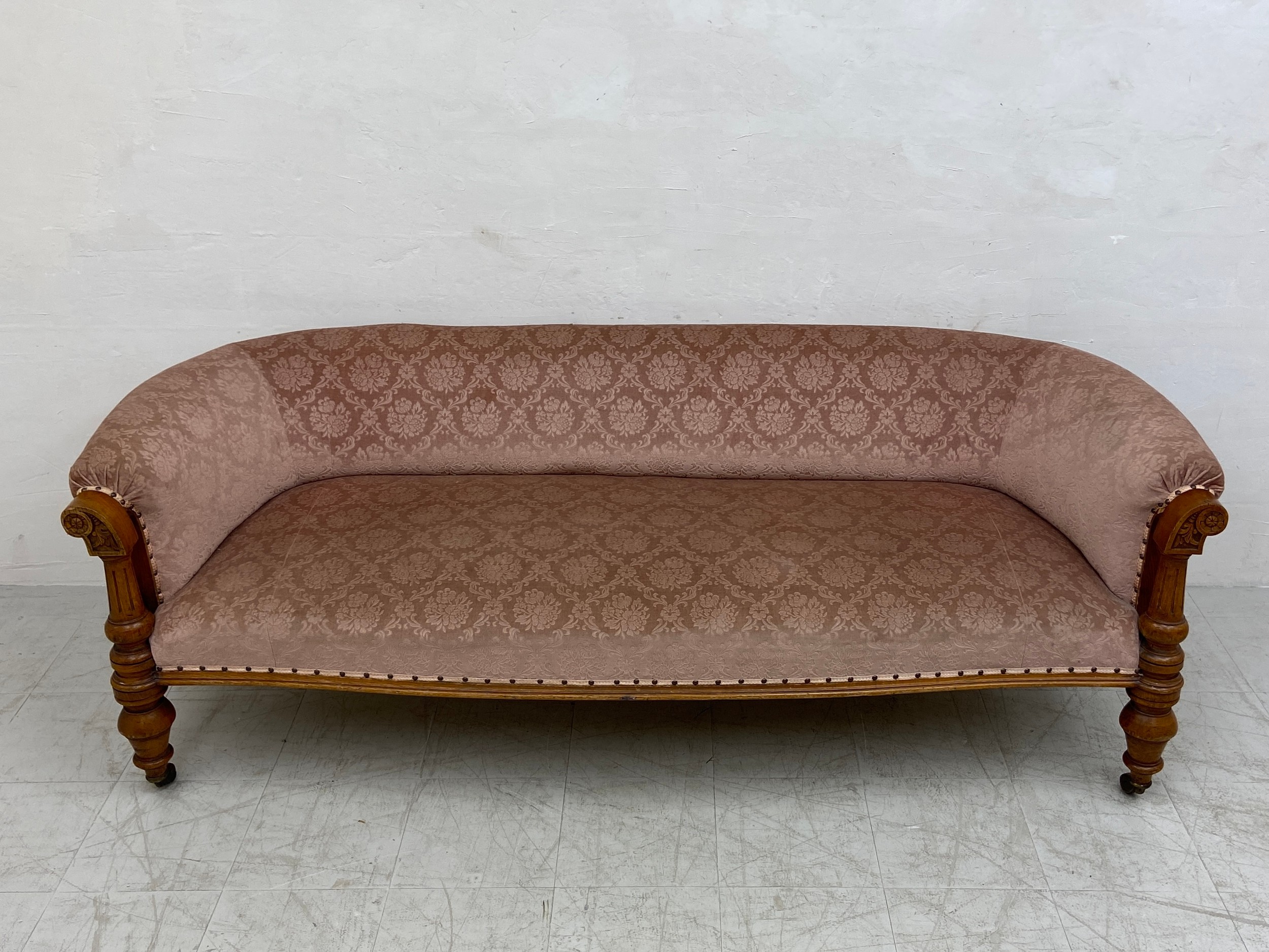 A mid 19th century oak sofa re-upholstered in foliate dusty pink raised on turned and carved - Image 2 of 6