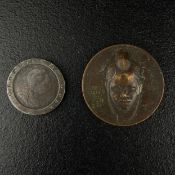 A Georg III Britannia coin and a Senegalese Wolof coin. Dia.6cm (largest coin)