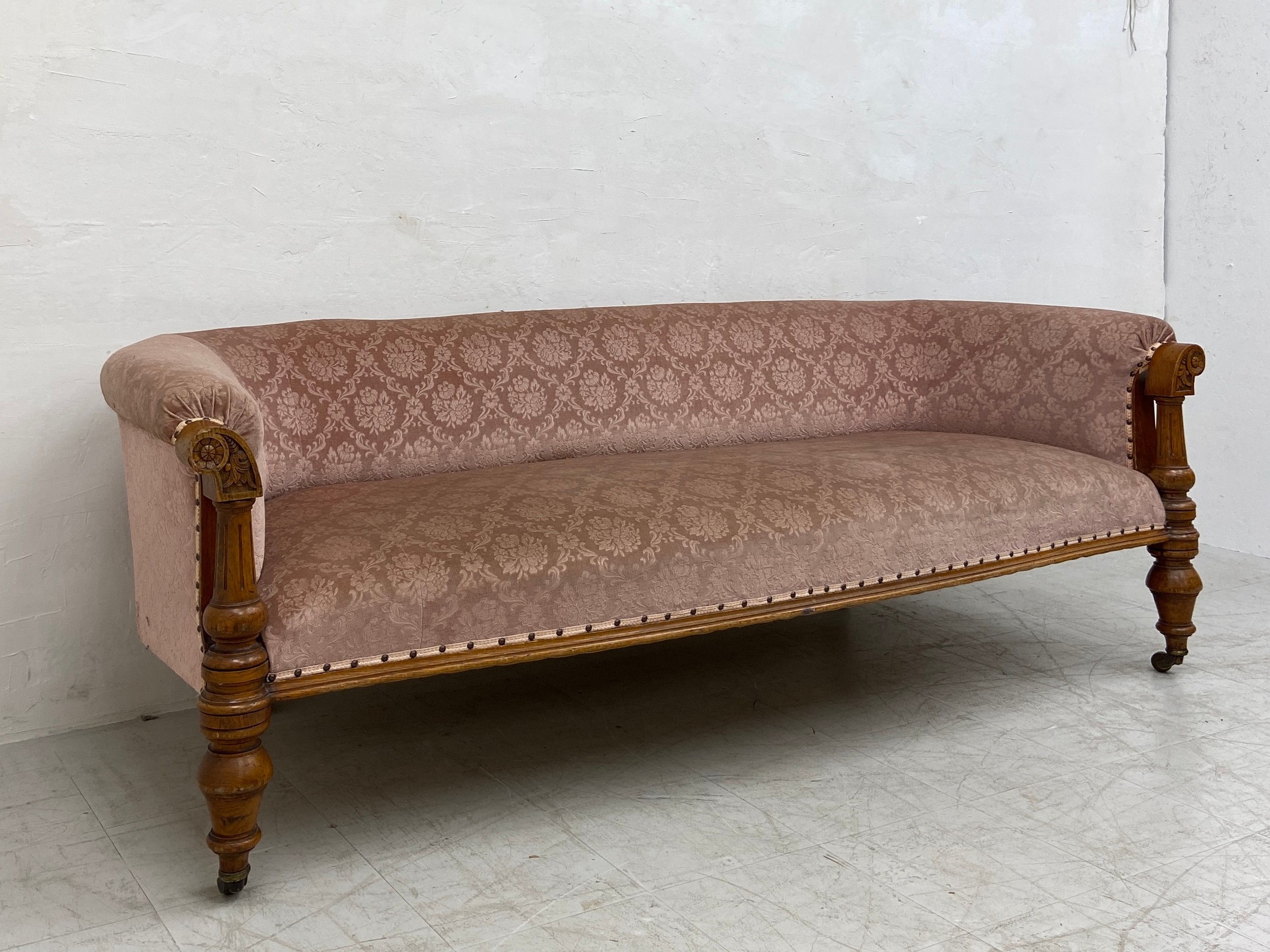 A mid 19th century oak sofa re-upholstered in foliate dusty pink raised on turned and carved - Image 3 of 6