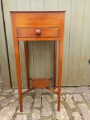 A 19th century mahogany occasional table having a square top over a single frieze drawer raised on