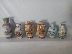 A mixed collection of Oriental ceramics to include a Canton Famille Jaune style baluster vase, a