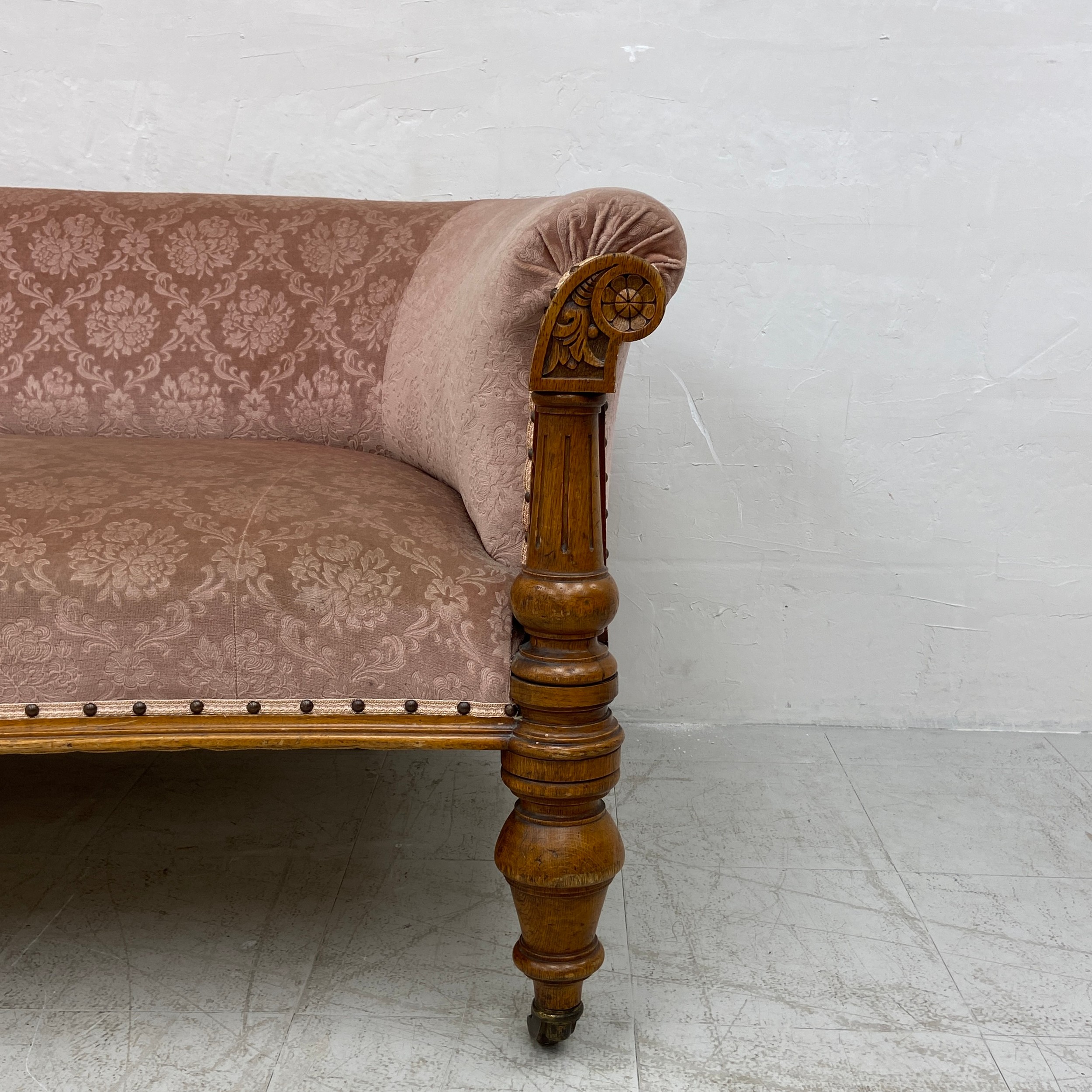 A mid 19th century oak sofa re-upholstered in foliate dusty pink raised on turned and carved - Image 6 of 6