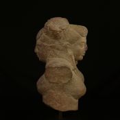 An Indian possibly Gupta period carved red sandstone figural double-sided bust depicting Buddha