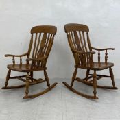 A pair of of 19th century birch bar back Windsor rocking chairs with elm saddle seats. H.106cm