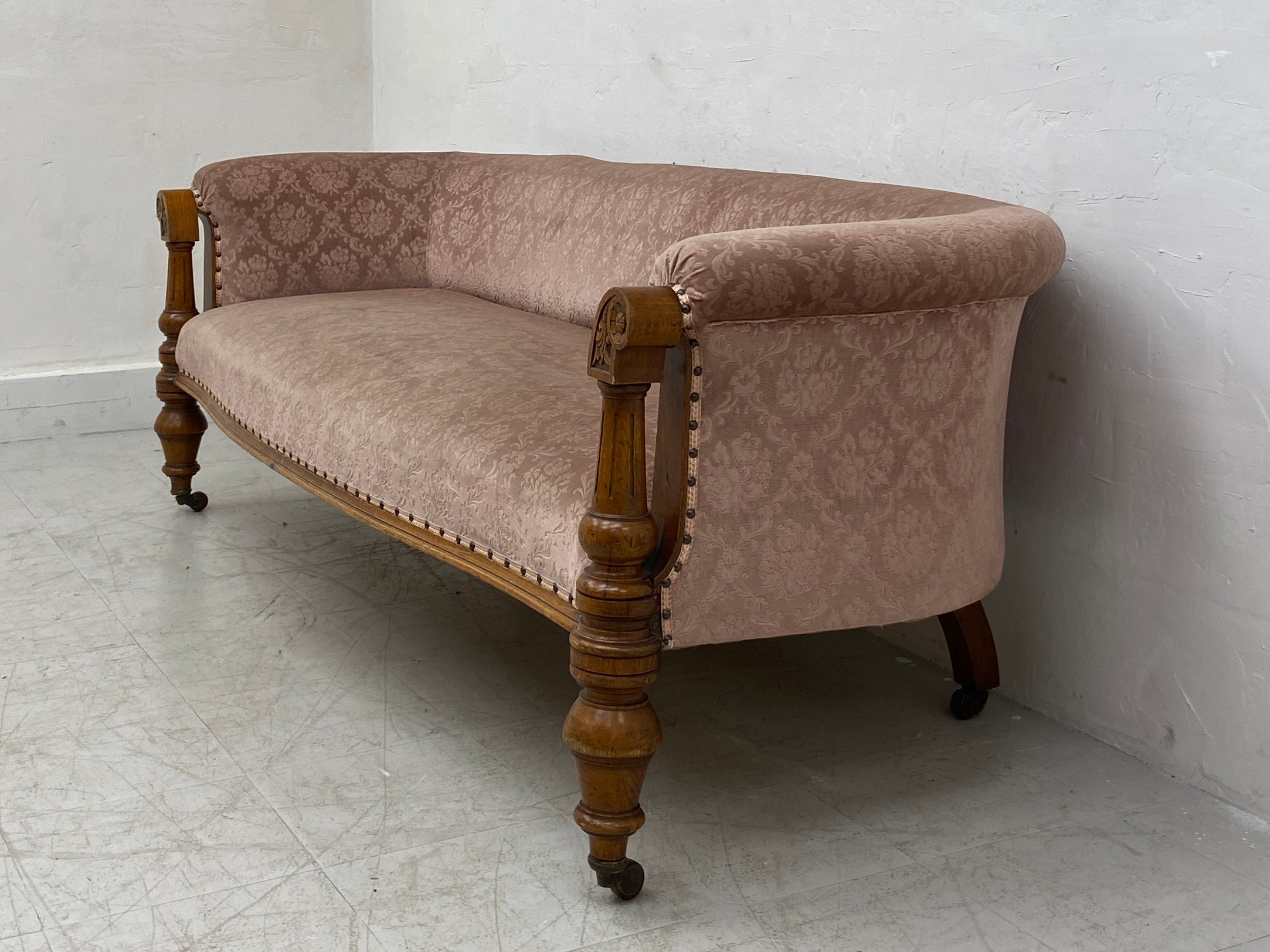 A mid 19th century oak sofa re-upholstered in foliate dusty pink raised on turned and carved - Image 4 of 6