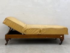 A 19th century mahogany day bed with adjustable reclining action on brass castors. H.50 L.198 D.72cm