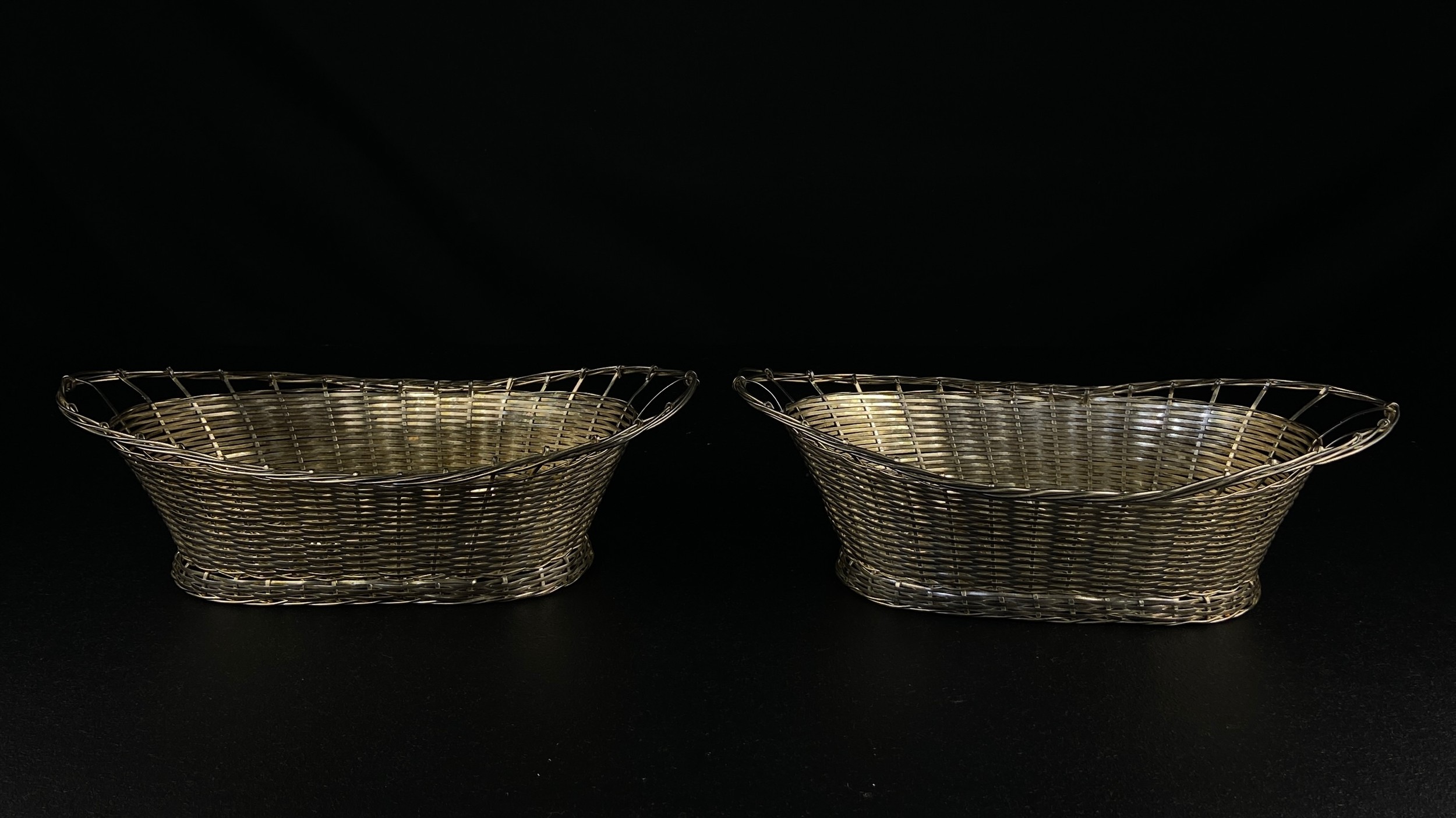 A pair of silver plated basket-weave dishes. W.30.5cm