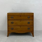 A Georgian mahogany chest of three long drawers on splay supports. H.81 W.89 D.41cm