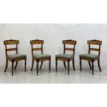 A set of four mid 19th century North European birch and rosewood dining chairs with floral
