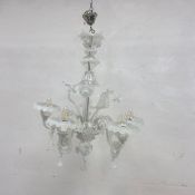 A cut crystal five branch chandelier with profuse foliate and flowerhead stems and cut crystal