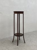 A C.1900 mahogany plant stand having a circular satinwood inlaid top raised on four flat splayed